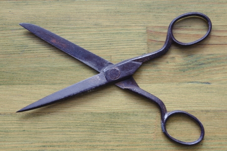 vintage scissors on the geen wooden backgroundの写真素材