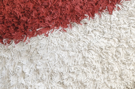 detailed carpet background with white and red colorsの写真素材