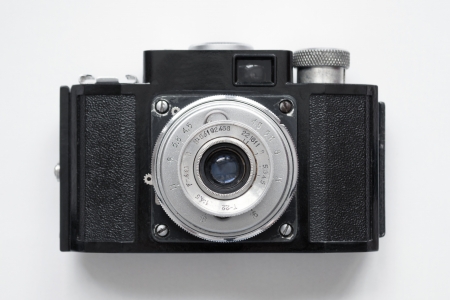 vintage camera on white background; focus on objective lensの写真素材