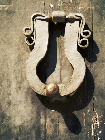 vintage weathered handle on the old wooden doorの写真素材
