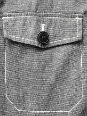 gray jacket pocket closed on black button
の写真素材