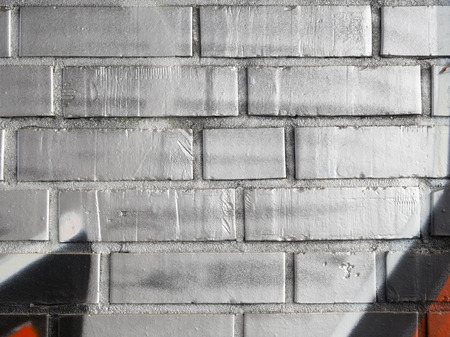fragment of brick wall painted by silver colorの写真素材