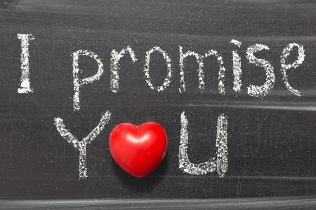 I promise you phrase handwritten on chalkboard with heart symbol instead of Oの写真素材