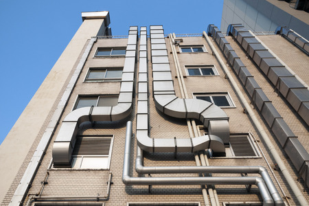 industrial building exterior with many metallic pipesのeditorial素材
