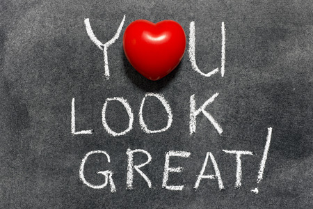 you look great exclamation handwritten on blackboard with heart symbol instead of Oの写真素材