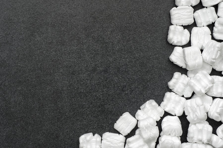 white filling package pieces on chalkboard with a lot of blank spaceの写真素材