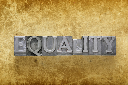 equality word made from metallic letterpress type on vintage cardboardの写真素材