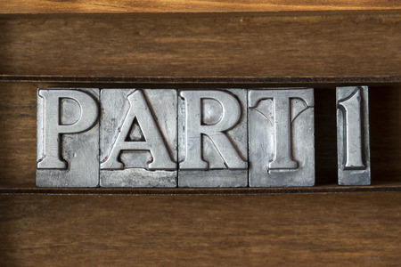 part 1 phrase made from metallic letterpress type on wooden tray