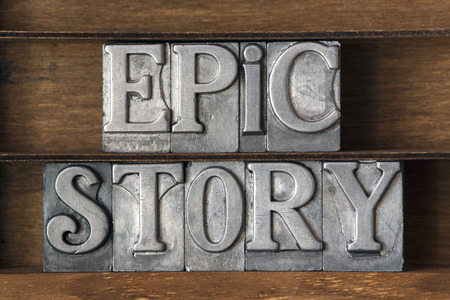 epic story phrase made from metallic letterpress type on wooden trayの写真素材