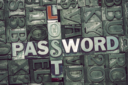 lost password crossword concept made from metallic letterpress blocks on letters backgroundの写真素材