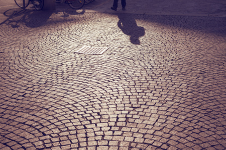 Milan cobblestone pavement pattern with scenic shadowsの写真素材