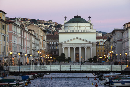 TRIESTE, ITALY - OCTOBER 21: scenic evening city scene with view to New Sant'Antonio Church at the end of the Grand Canal in Trieste, Italy on October 21, 2015.のeditorial素材