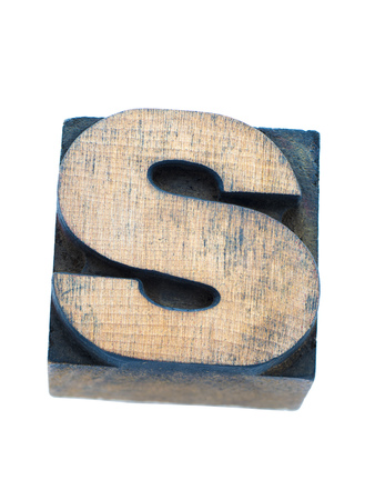 vintage wooden capital letter S from letterpress set isolated on whiteの写真素材