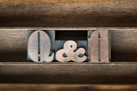 Q and A abbreviation made from vintage letterpress type on wooden tray