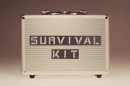 metallic case with survival kit phrase stencil print on it sideの写真素材
