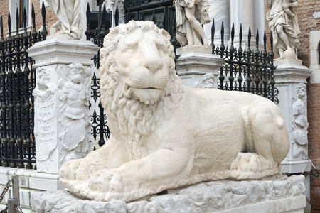 marble lion sculpture on the Arsenal entrance in Venice, Italyの写真素材