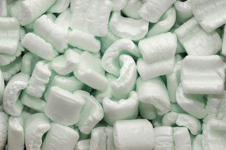 detailed background of many green packing foam piecesの写真素材