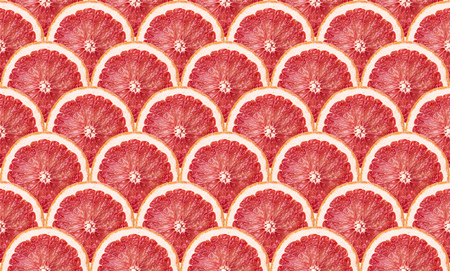 detailed background made from many grapefruit slicesの写真素材