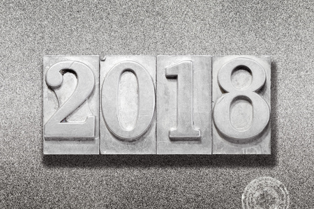 solid 2018 numbers made from vintage letterpress on metallic textured backgroundの写真素材