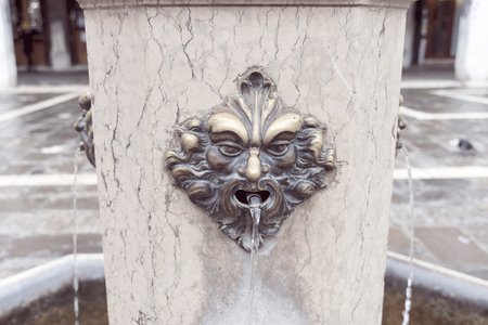 drinking fountain on city square by daytime in Venice, Italyの写真素材