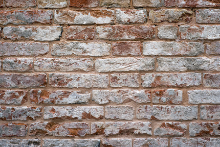 detailed texture of weathered red brick wall from Venice, Italy