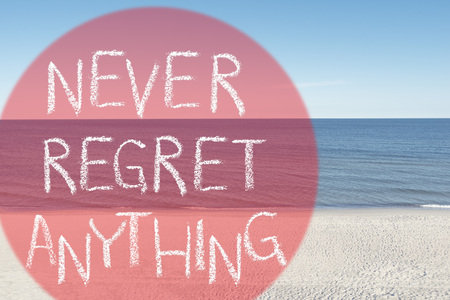 never regret anything slogan handwritten on empty beach backgroundの写真素材