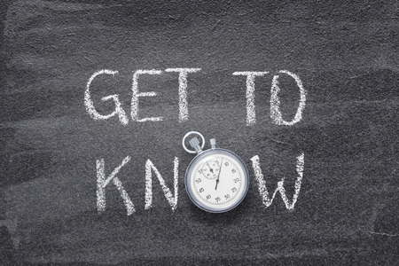 get to know phrase written on chalkboard with vintage stopwatch used instead of O