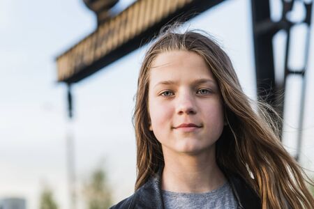 teenage girl face protrait at windy air outdoors by summer  eveningの写真素材