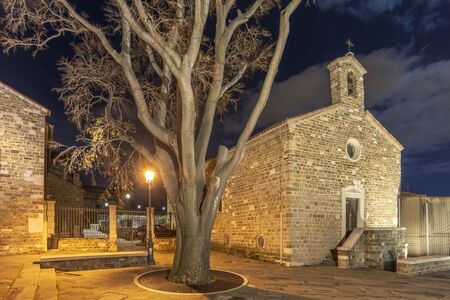 night cityscape at the place of ancient Cathedral of San Giusto in Trieste, Italyの写真素材
