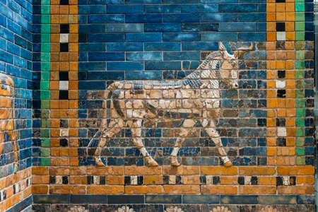 walking Aurochs symbol of Hadad deity on blue ceramic wall from ancient Babylon
