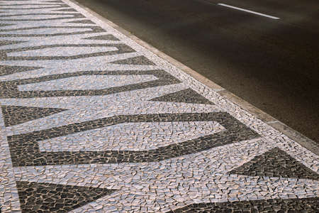 traditional cobblestone tile pavement ornament in Funchal city, Madeira Island, Portugalの写真素材