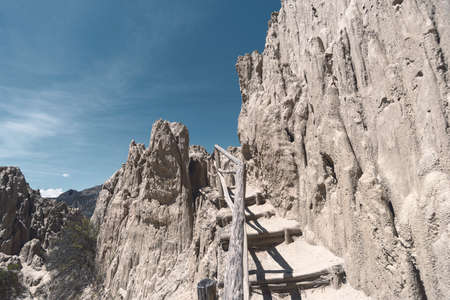 pathway with wooden handrails between sand rocks formation in Moon Valley near La Paz city in Boliviaの写真素材
