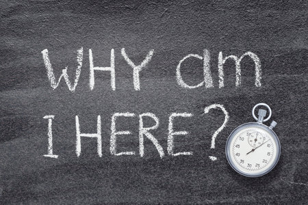 why am I here question written on chalkboard with vintage precise stopwatchの写真素材
