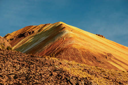 colorful ridge of Tunupa volcano by sunny morning in Bolivia
