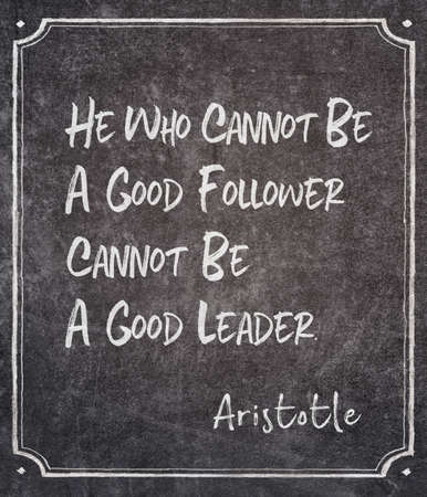 He who cannot be a good follower cannot be a good leader- ancient Greek philosopher Aristotle quote written on framed chalkboardの写真素材