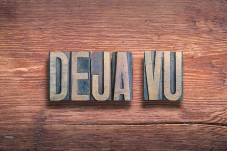 deja vu French term meaning - already seen, combined on vintage varnished wooden surfaceの写真素材