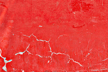 real detailed red color painted wall backgroundの写真素材