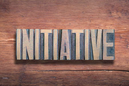 initiative word combined on vintage varnished wooden surfaceの写真素材