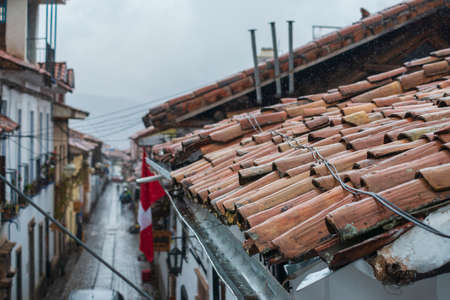 rainy day in Cusco, Peru with focus on foreground roofの写真素材