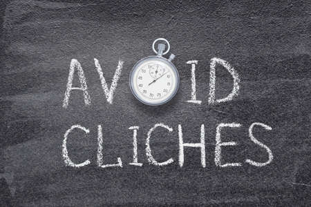 avoid cliches phrase written on chalkboard with vintage precise stopwatchの写真素材