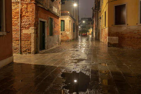 night cityscape of rainy Venice, Italyの写真素材