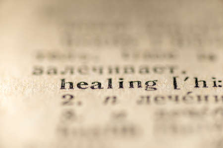 focus on healing word printed inside vintage dictionaryの写真素材