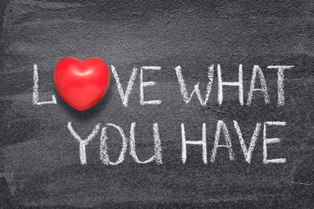 love what you have phrase written on chalkboard with red heart symbol instead of Oの写真素材