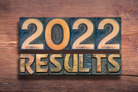 results 2022 phrase combined from vintage letterpress on wooden surfaceの写真素材