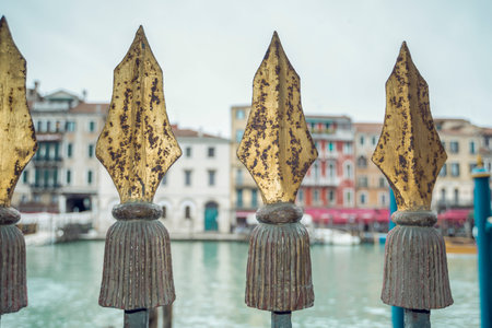 rusty vintage metallic spikes of channel fence in Venice, Italyの写真素材