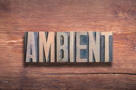 ambient word combined on vintage varnished wooden surfaceの写真素材
