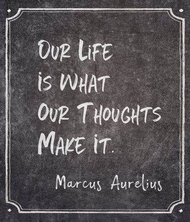Our life is what our thoughts make it - ancient Roman emperor and Stoic philosopher Marcus Aurelius quote written on framed chalkboardの写真素材