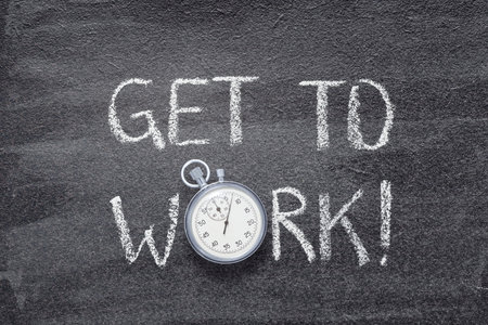 get to work exclamation written on chalkboard with vintage precise stopwatchの写真素材