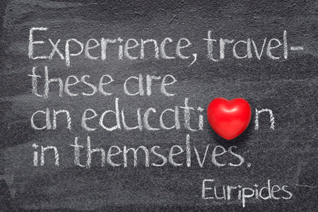 Experience, travel - these are an education in themselves - quote of ancient Greek philosopher Euripides written on chalkboard with red heart symbolの写真素材