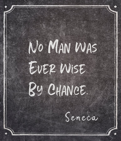 No man was ever wise by chance - ancient Roman philosopher Seneca quote written on framed chalkboardの写真素材